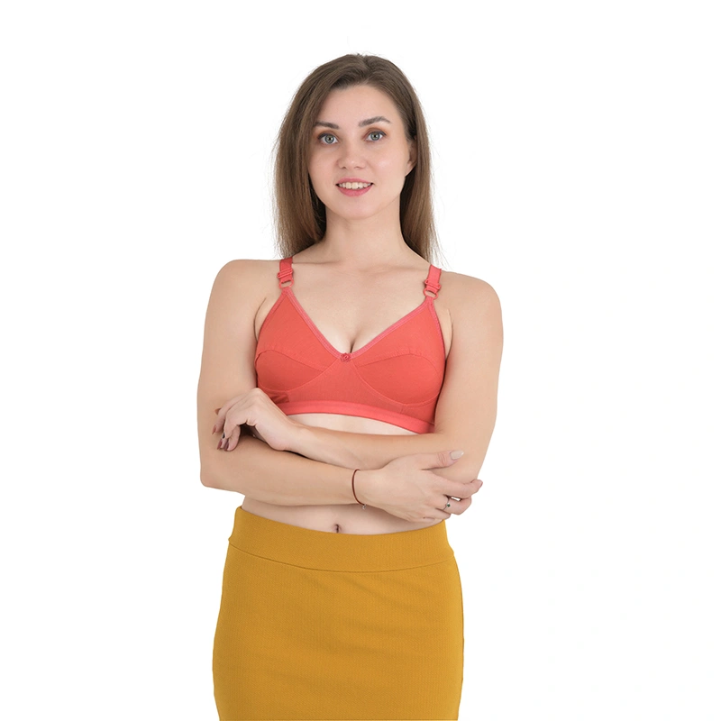 Solid coral bra with adjustable straps and mustard yellow skirt - lingerie ecommerce photography by Lohar Studio Delhi